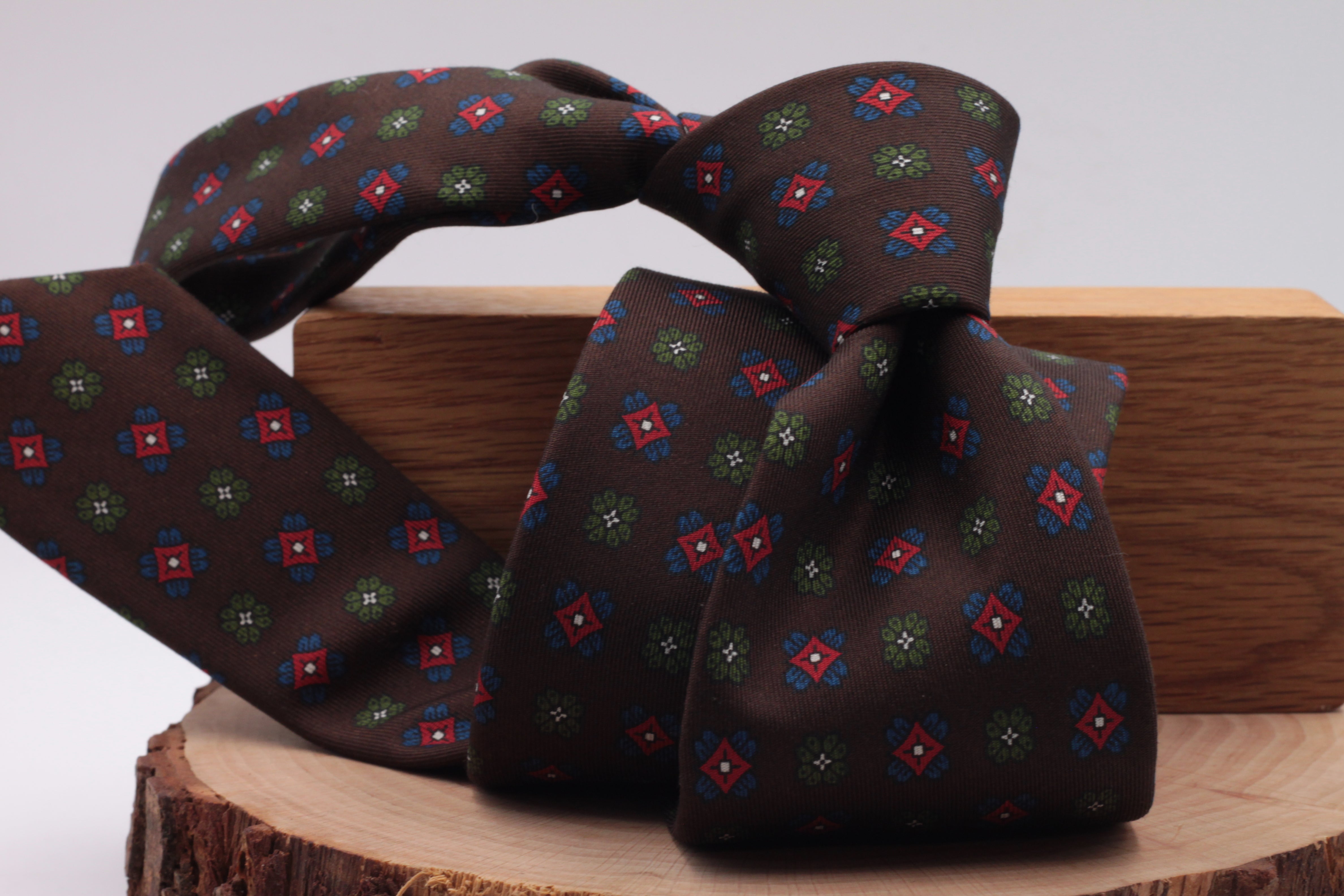 Brown, green, red and royal blue motif tie