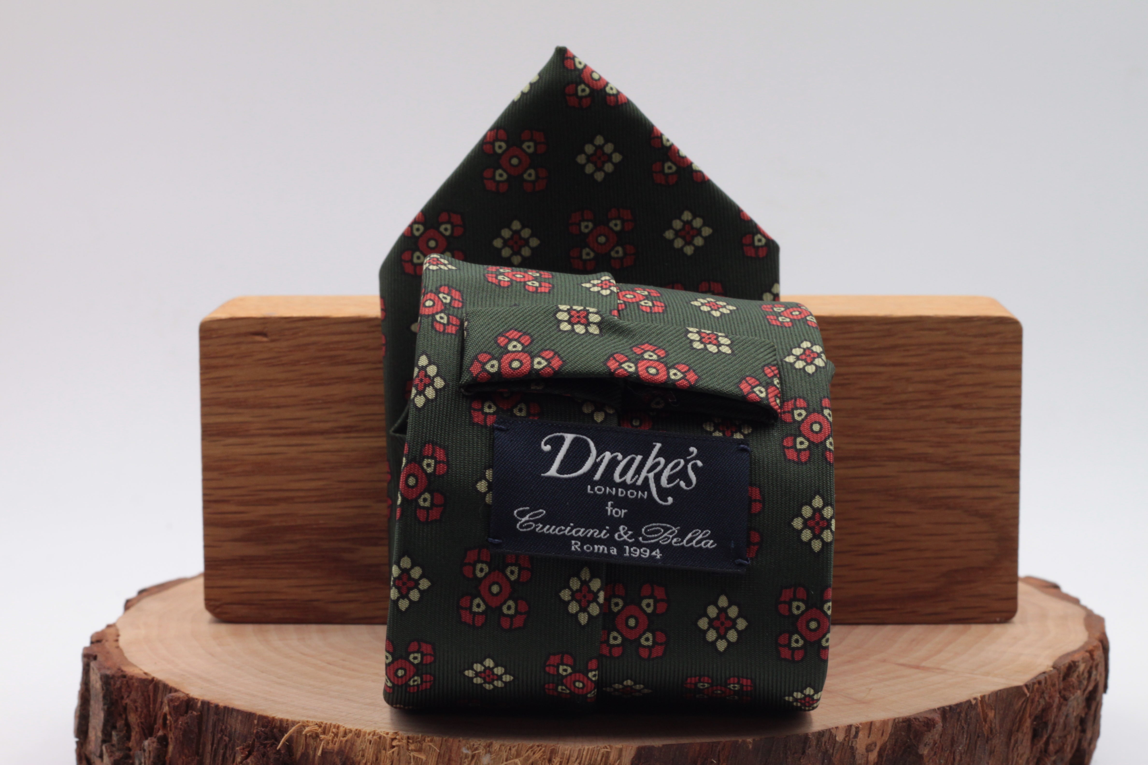 Bottle green, red and cream motif tie