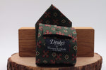 Bottle green, red and cream motif tie