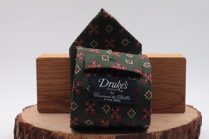 Bottle green, red and cream motif tie