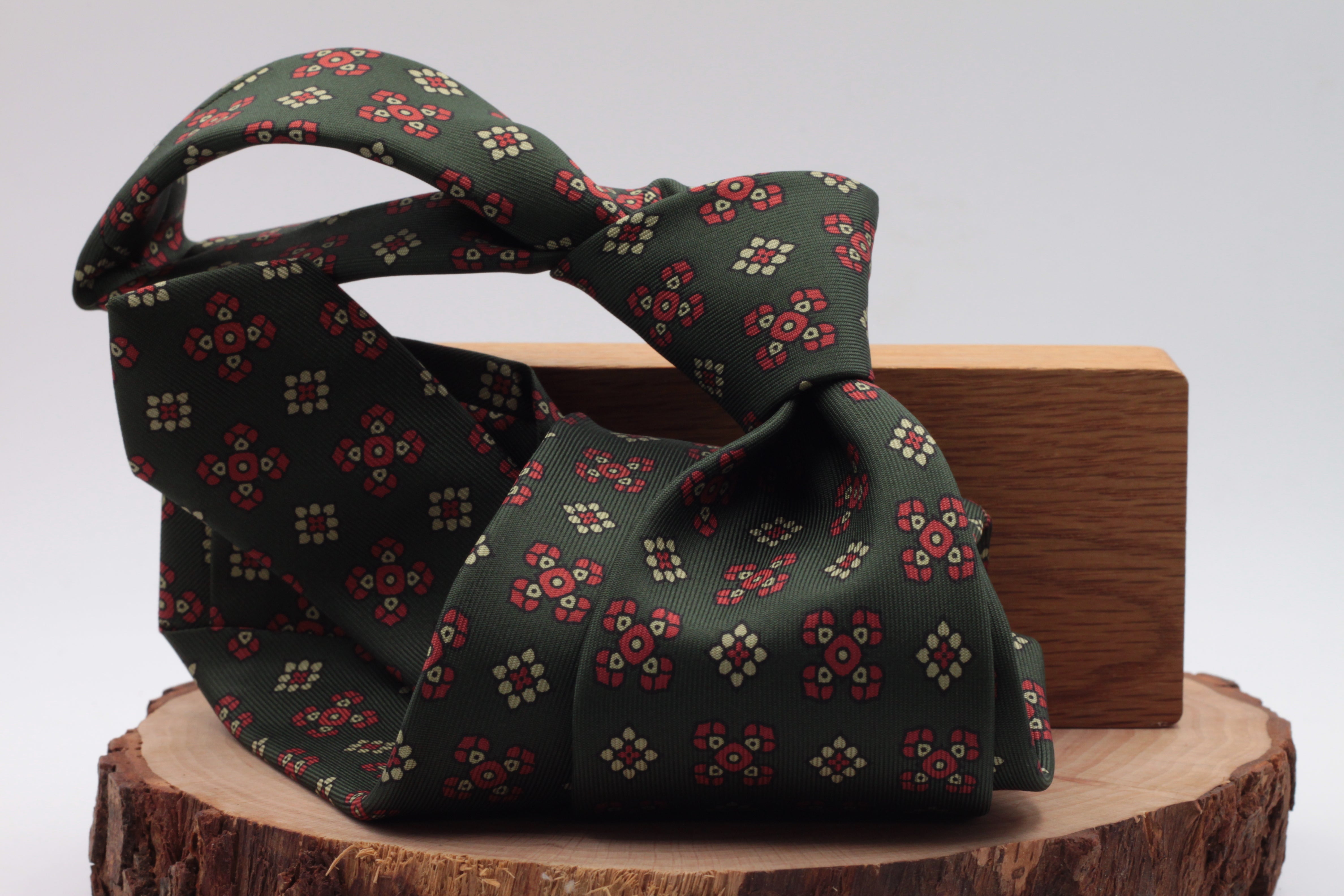 Bottle green, red and cream motif tie