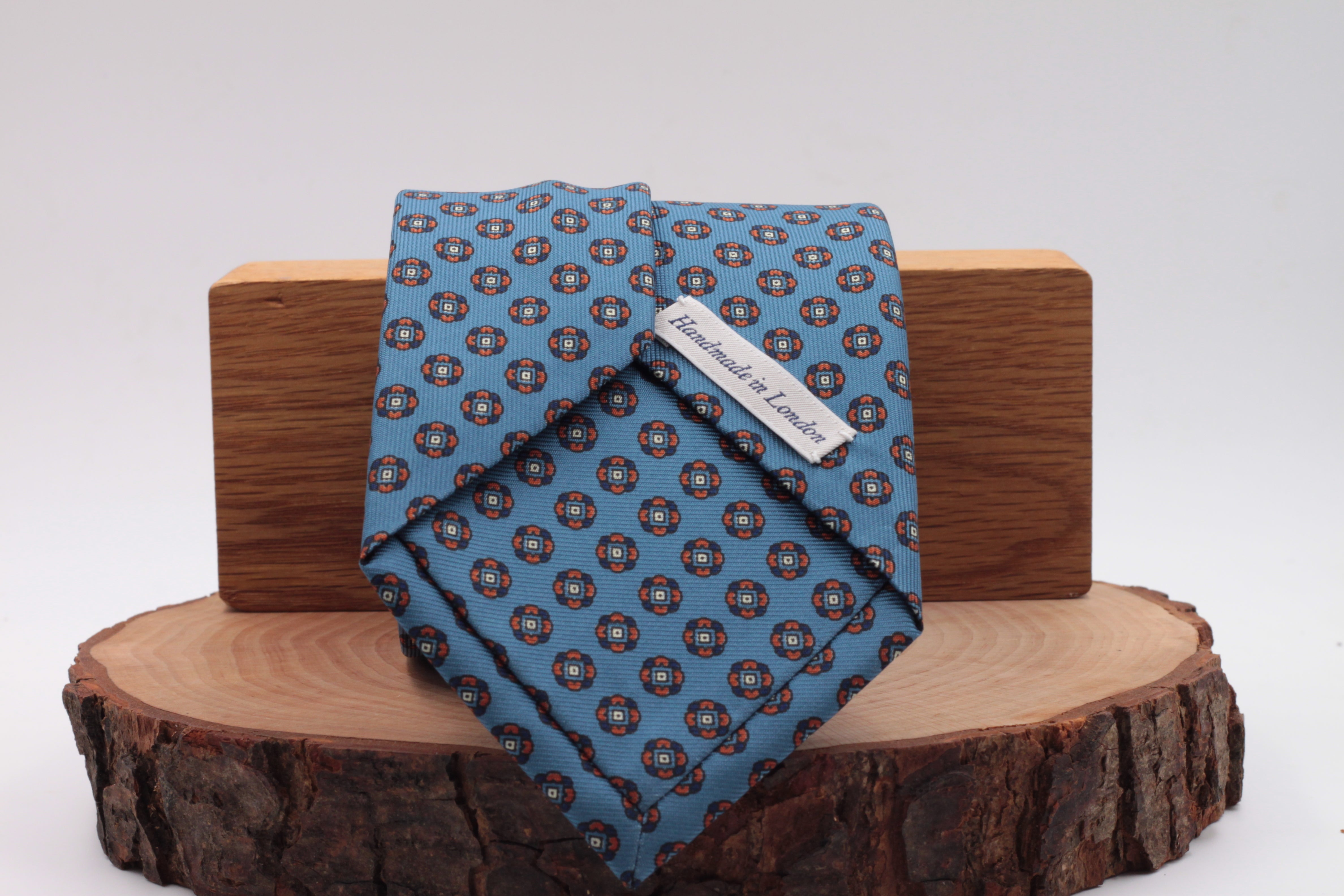 Royal blue, blue navy and orange motif tie