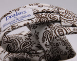 Drake's for Cruciani e Bella Printed 60% Silk 40% Cotton Self-Tipped Brown and White Paysley Motif Tie Handmade in London, England 8 cm x 149 cm #5411