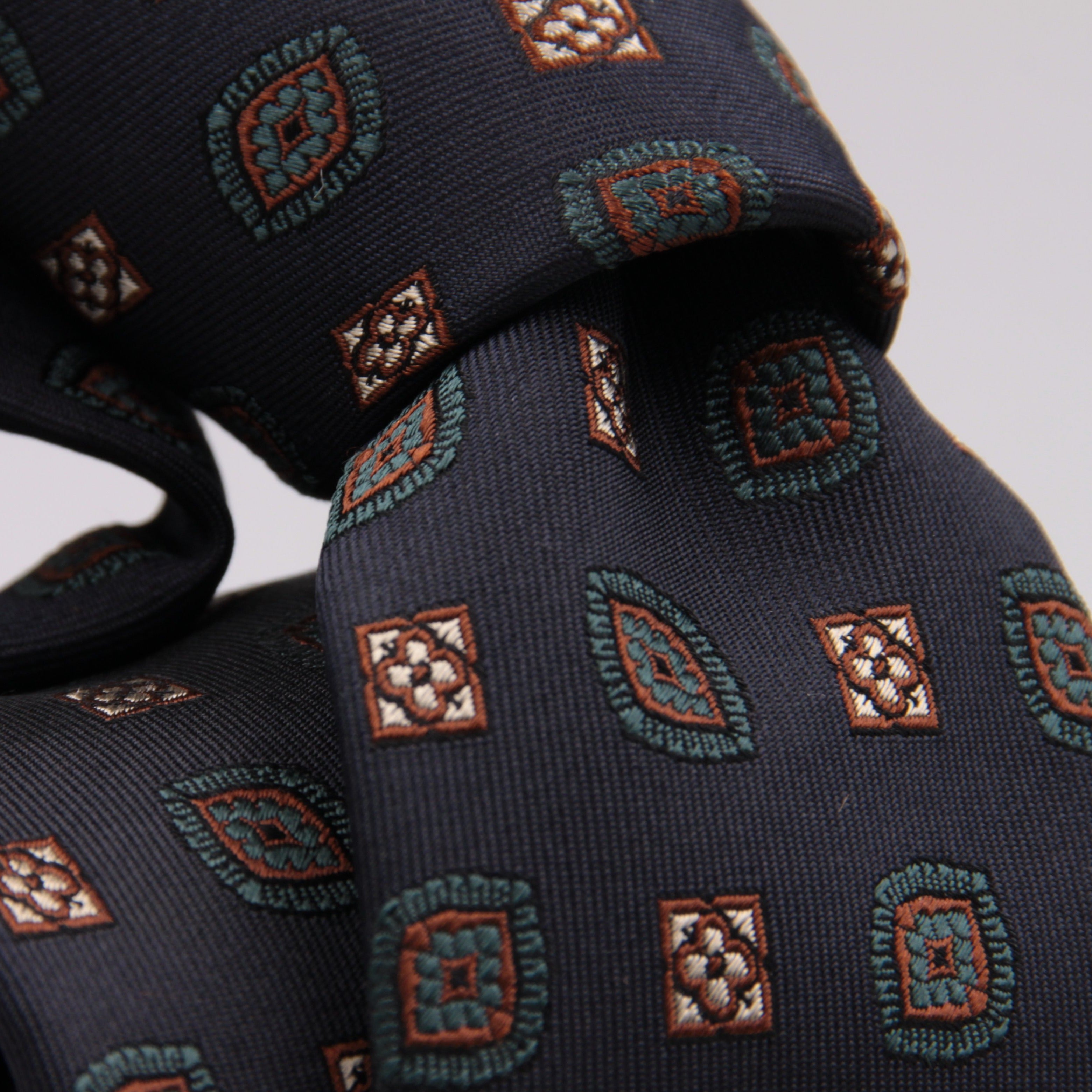 Drake's for Cruciani e Bella 100%  Woven Silk Tipped Blue, Green, Rust and Light Yellow Motif tie Handmade in London, England 8 cm x 150 cm #5190