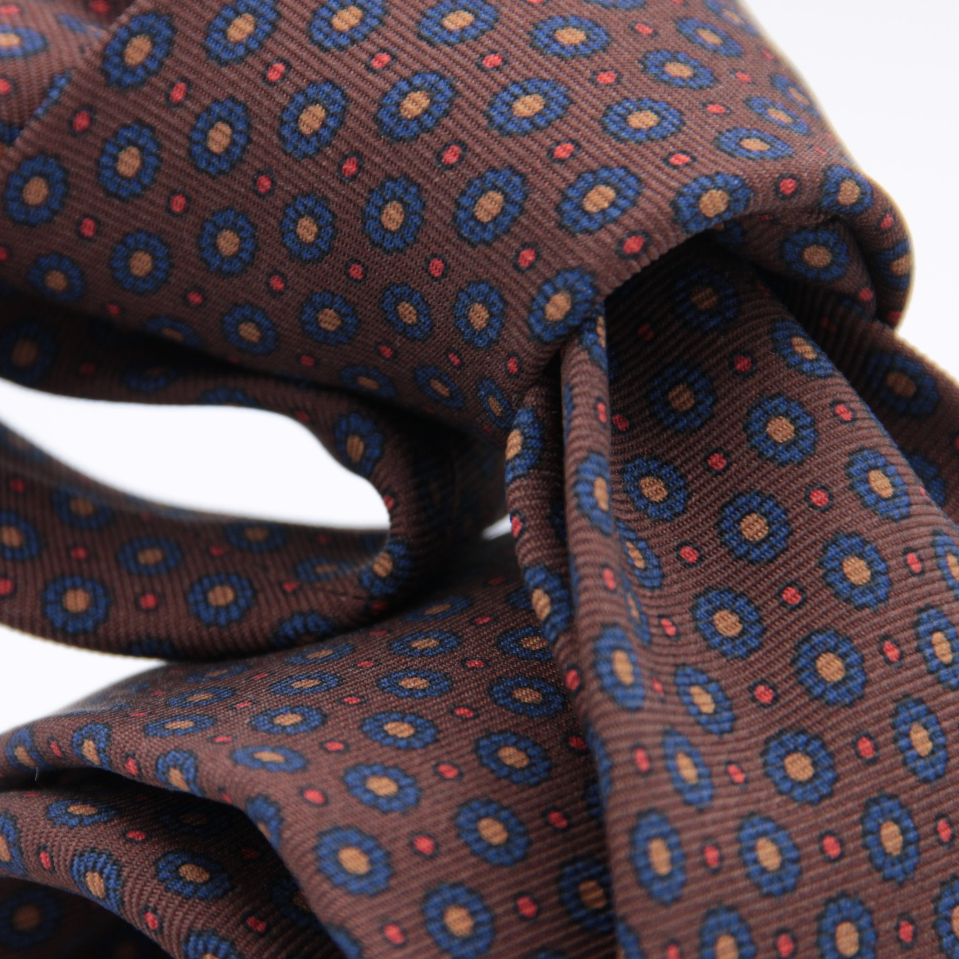 Holliday & Brown for Cruciani & Bella 100% printed Silk Self tipped Brown, Blue, Yellow and Red motif tie Handmade in Italy 8 cm x 150 cm 5036