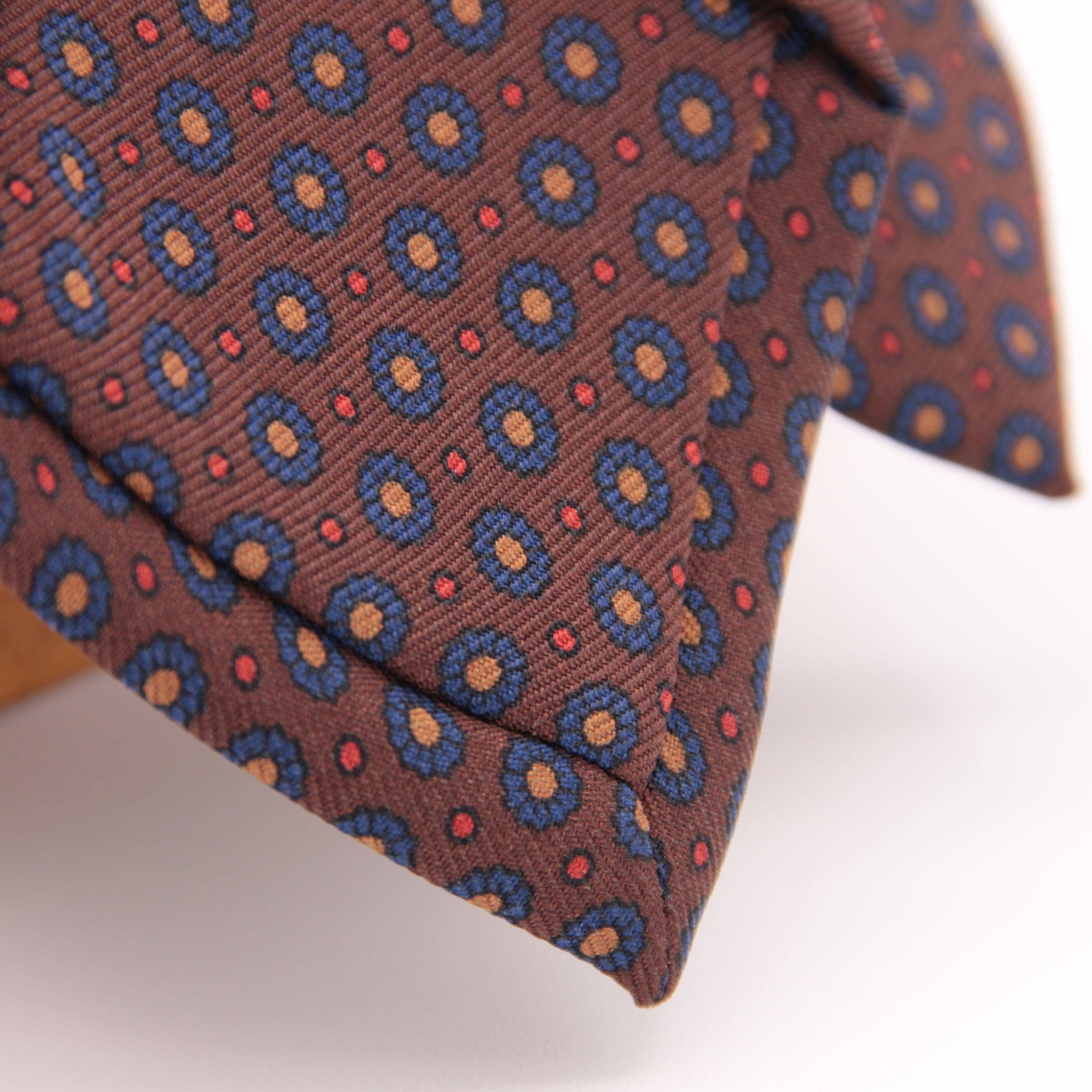Holliday & Brown for Cruciani & Bella 100% printed Silk Self tipped Brown, Blue, Yellow and Red motif tie Handmade in Italy 8 cm x 150 cm 5036
