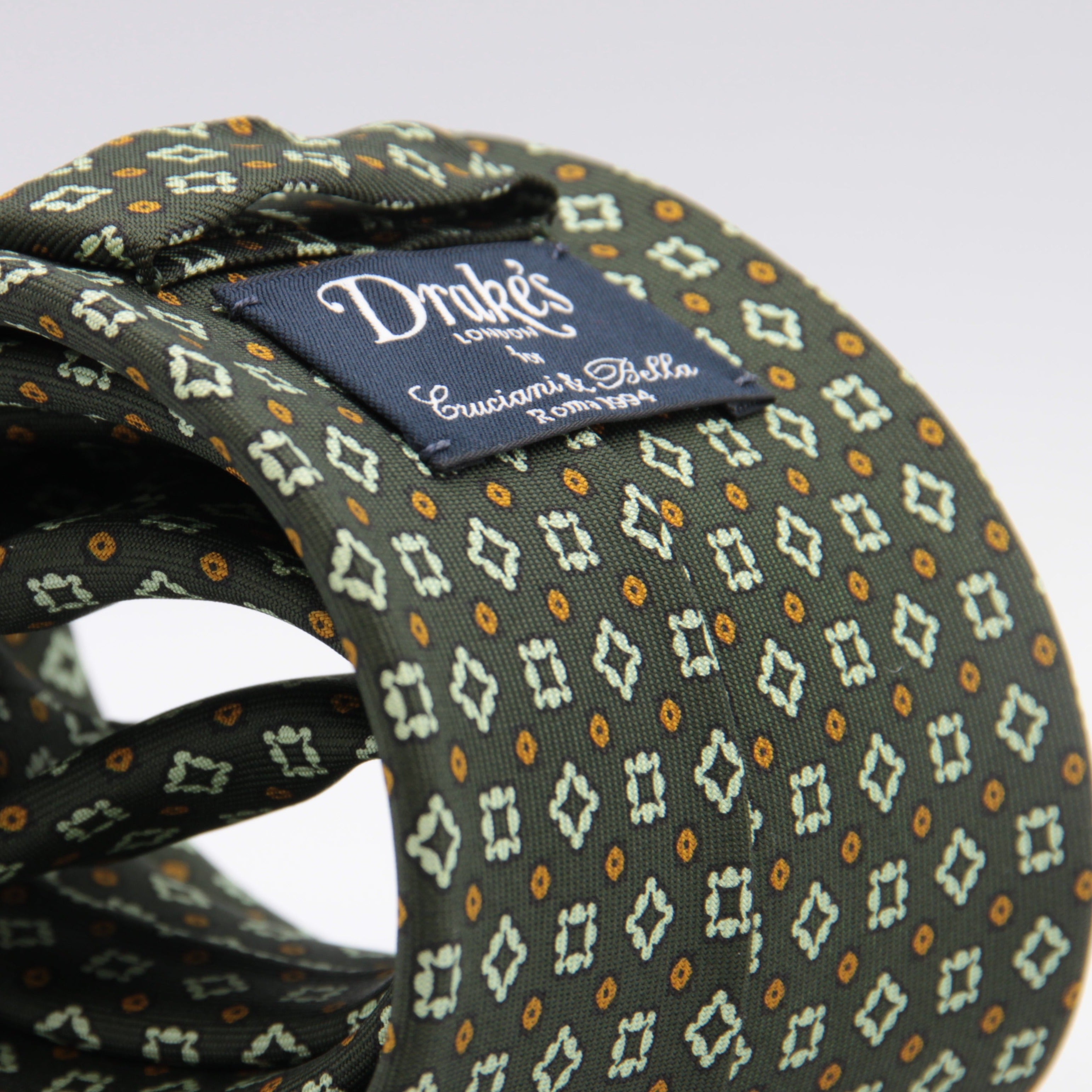 Drake's for Cruciani & Bella 36 oz Self-Tipped 100% Printed Silk Green, Orange and White Motif tie Handmade in London. England 9 cm x 150 cm