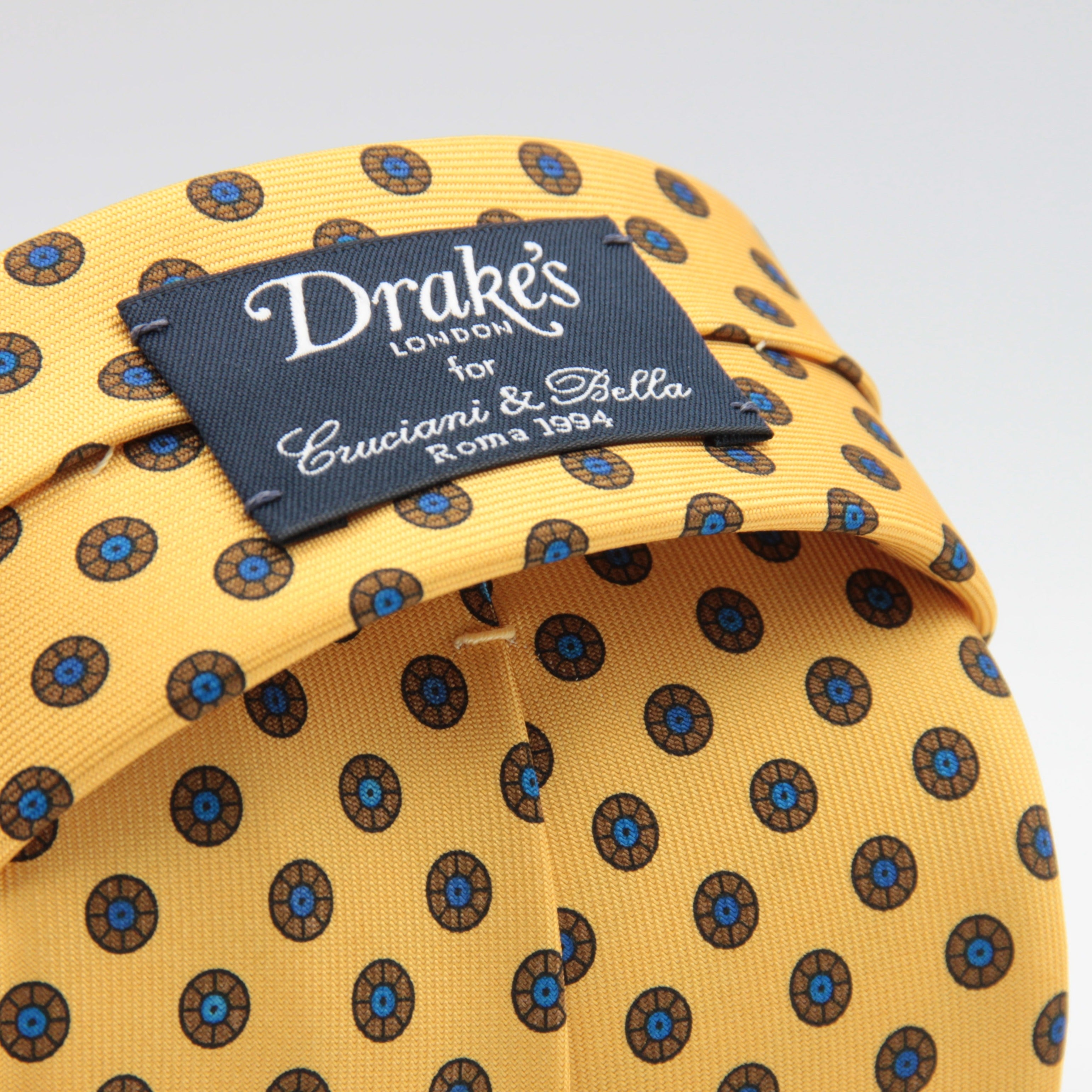 Drake's for Cruciani & Bella 36 oz Self-Tipped 100% Printed Silk Yellow, Brown and Blue Motif Tie Handmade in London. England 9 cm x 150 cm #6359