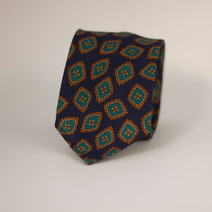 Cruciani & Bella 100%  Printed Wool  Unlined Hand rolled blades Dark Blue, Green, Orange and light beige Motif Tie  Handmade in Italy 8 cm x 150 cm #7296