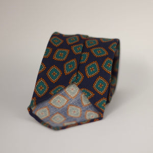Cruciani & Bella 100%  Printed Wool  Unlined Hand rolled blades Dark Blue, Green, Orange and light beige Motif Tie  Handmade in Italy 8 cm x 150 cm #7296