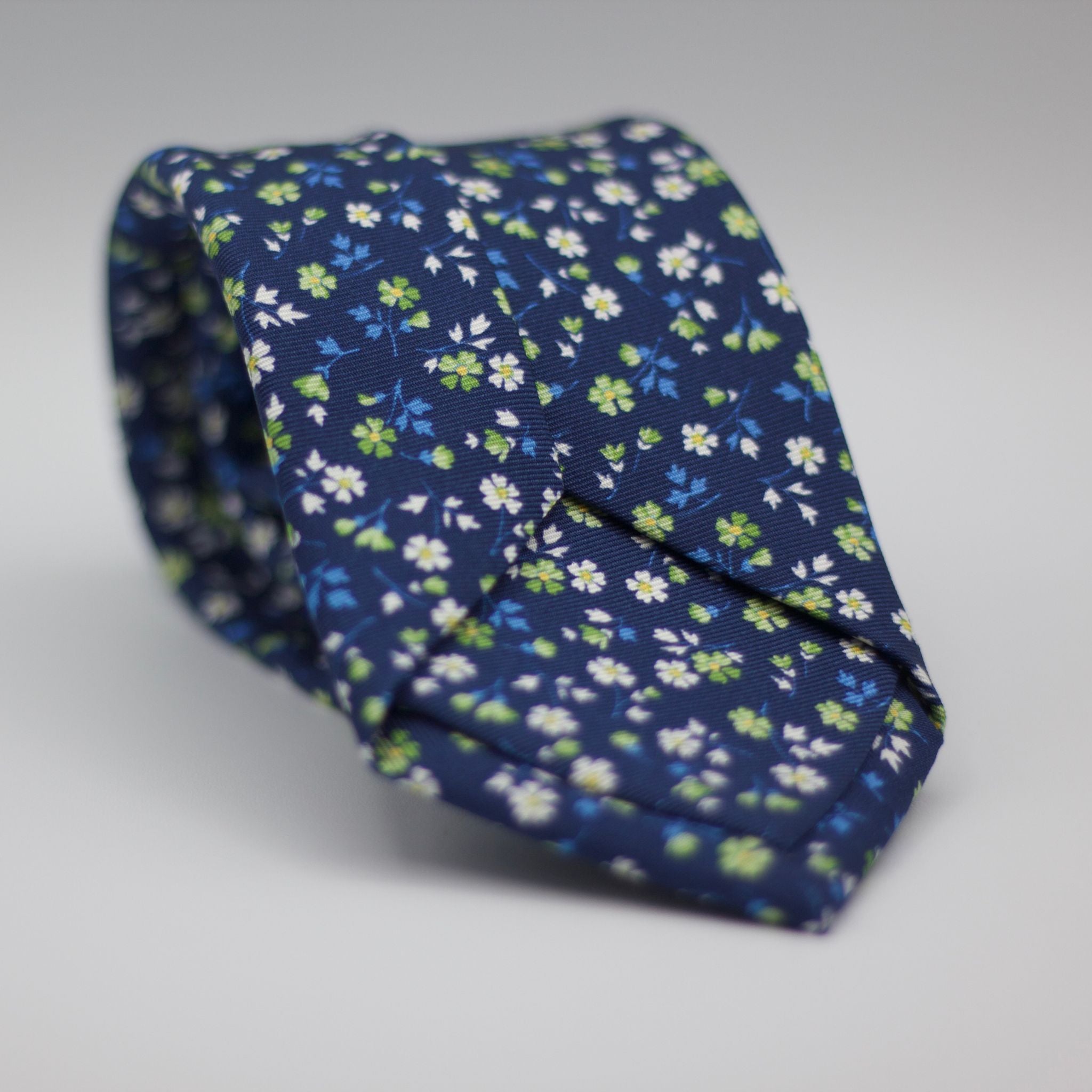 Holliday & Brown for Cruciani & Bella 100% printed Silk Self Tipped Holliday & Brown - Printed Silk -Blue, with White and Green Floral motif tie Handmade in Italy 8 cm x 150 cm #6310