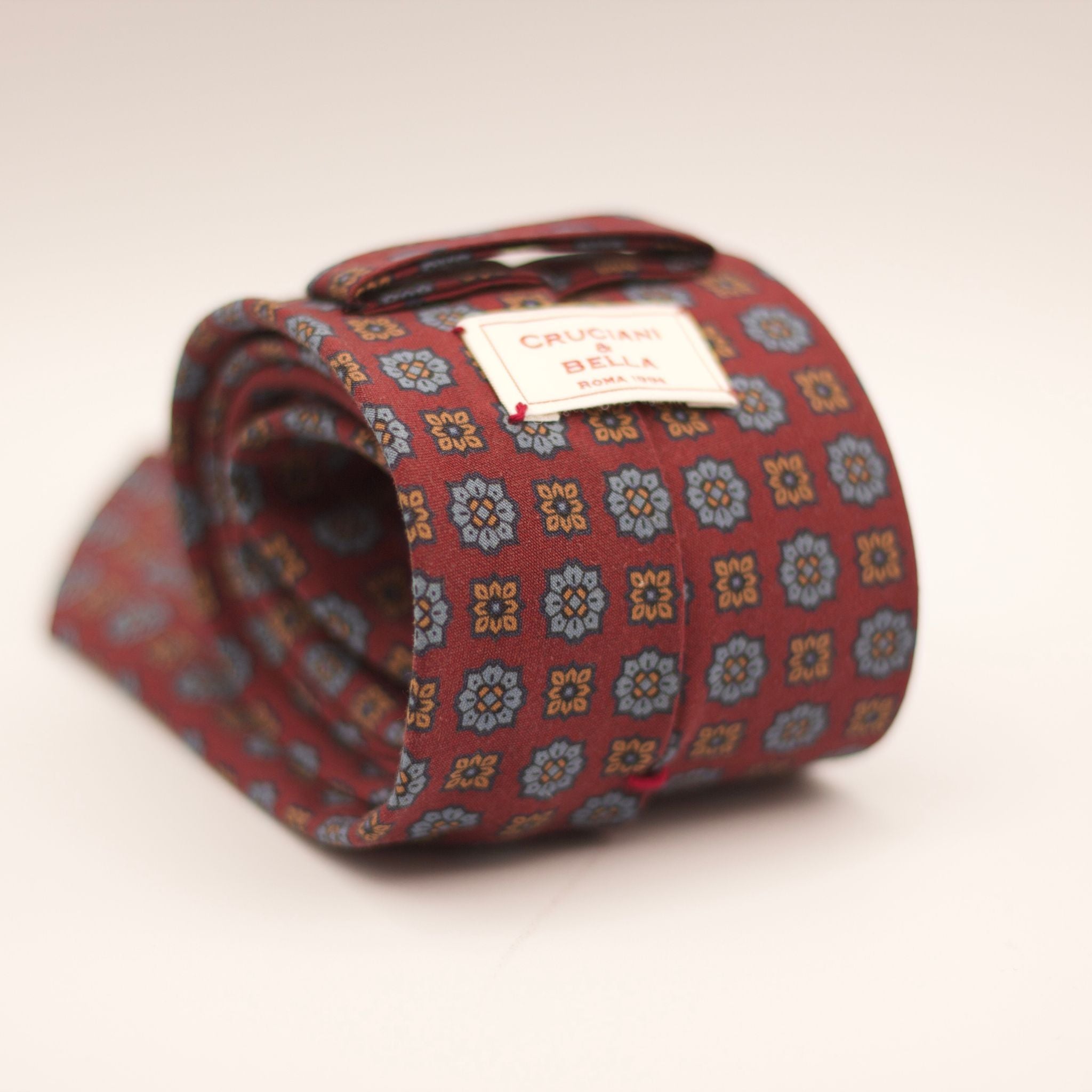 Cruciani & Bella  100% Printed Madder Silk  Italian fabric  Unlined tie Dark Red, Light Brown and light blue motif  8 cm x 150 cm #7502