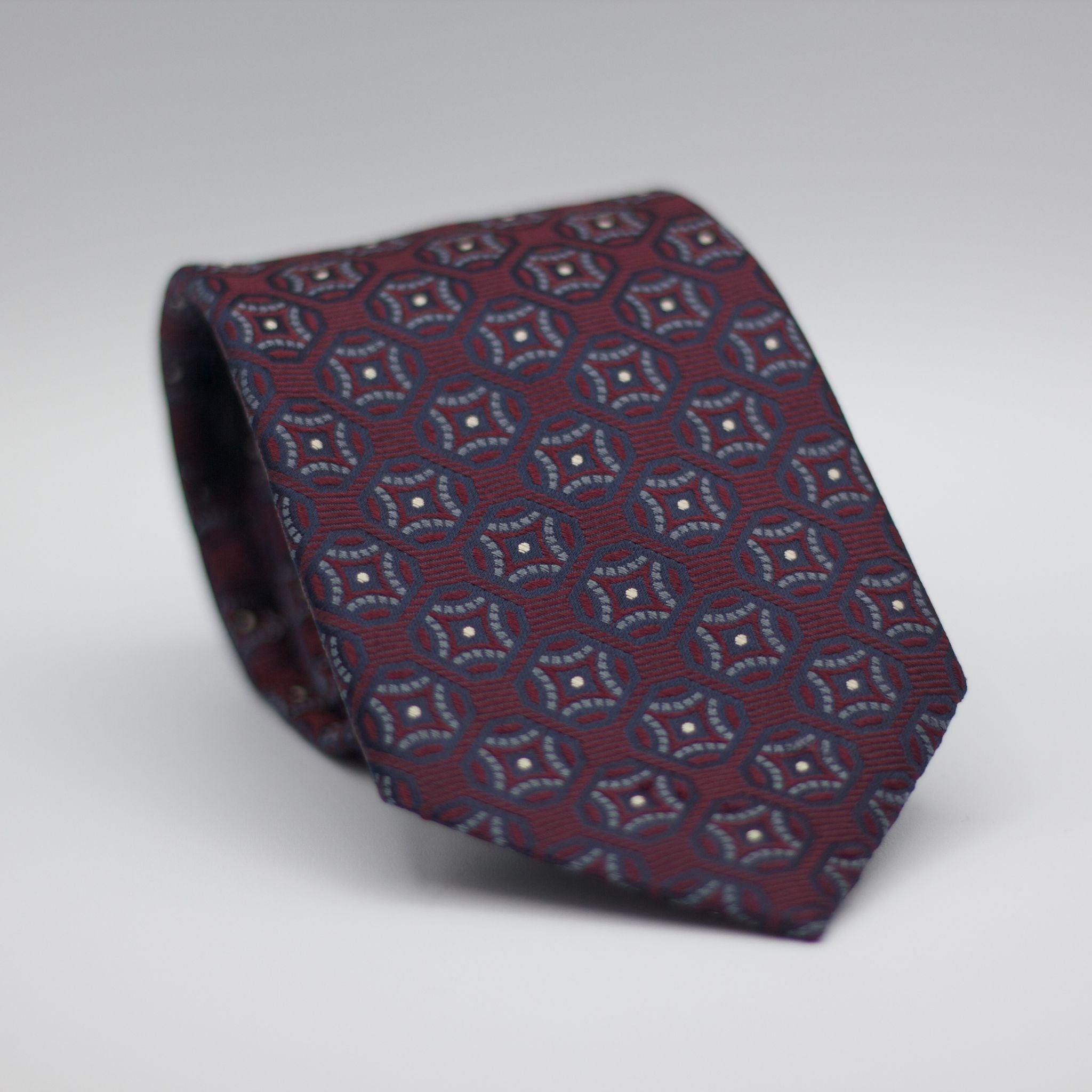 Holliday & Brown for Cruciani & Bella 100% Woven Jacquard Silk Tipped Burgundy with Grey and Blue Navy motif tie  Handmade in Italy 8 cm x 150 cm #6989
