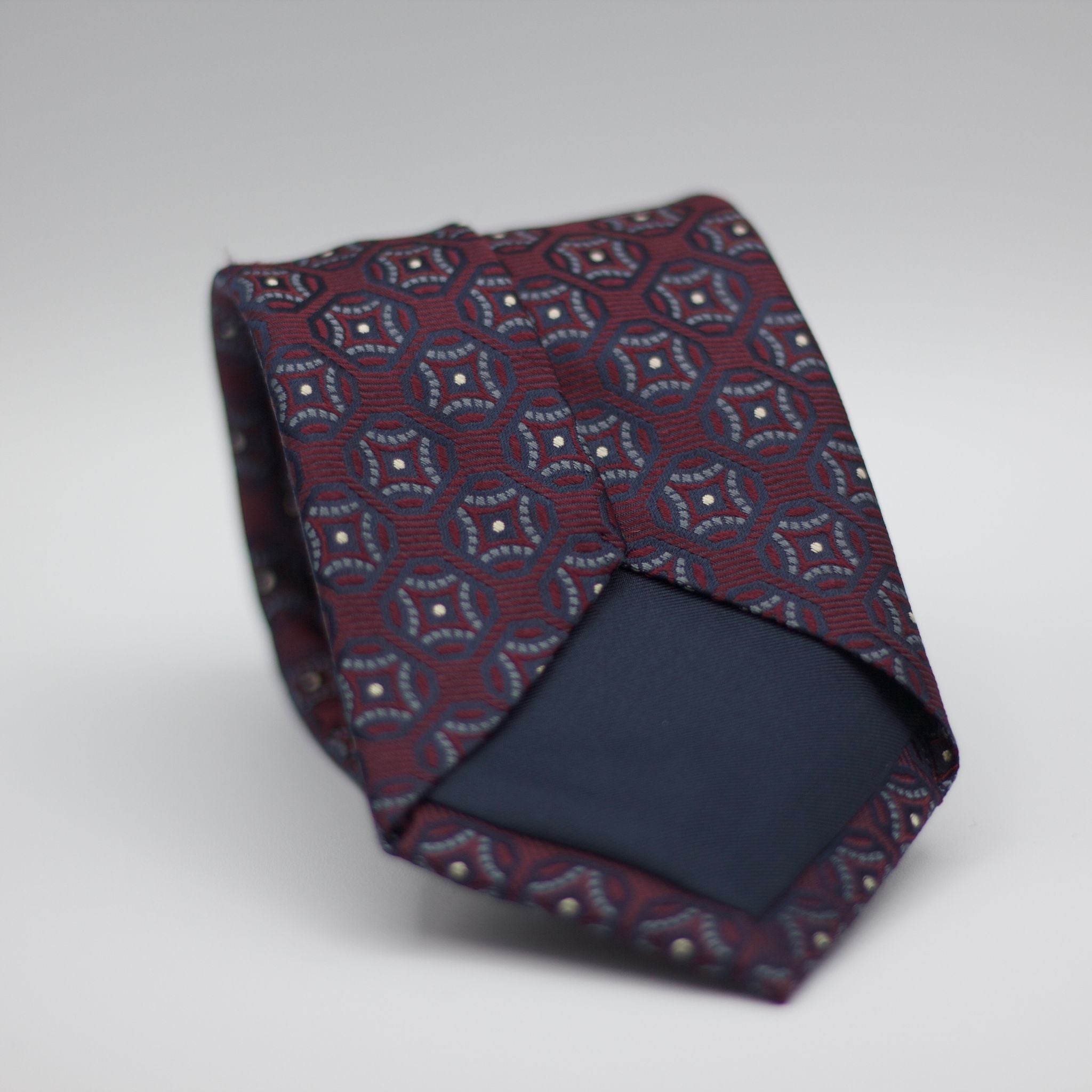 Holliday & Brown for Cruciani & Bella 100% Woven Jacquard Silk Tipped Burgundy with Grey and Blue Navy motif tie  Handmade in Italy 8 cm x 150 cm #6989