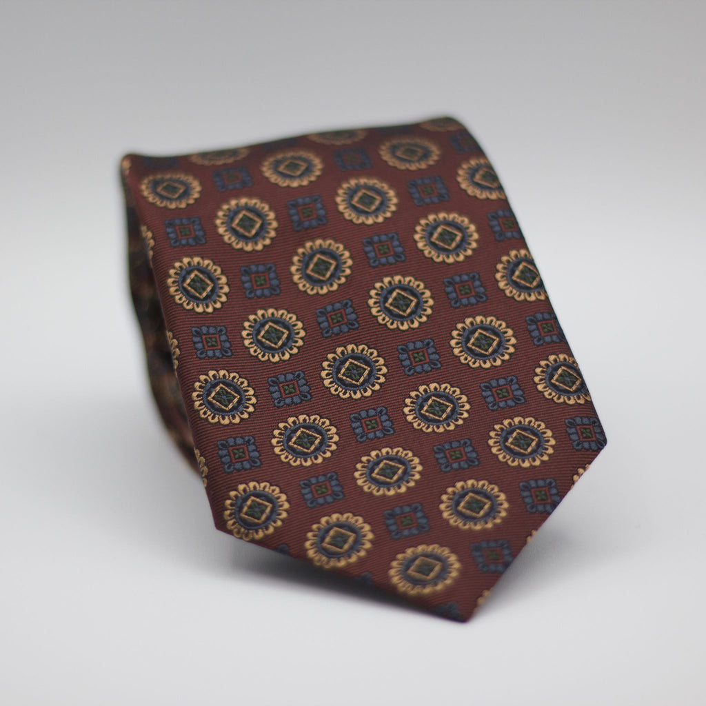 Holliday & Brown for Cruciani & Bella 100% Woven Jacquard Silk Tipped Bronze with Blue  and Gold motif tie Handmade in Italy 8 cm x 150 cm #7006