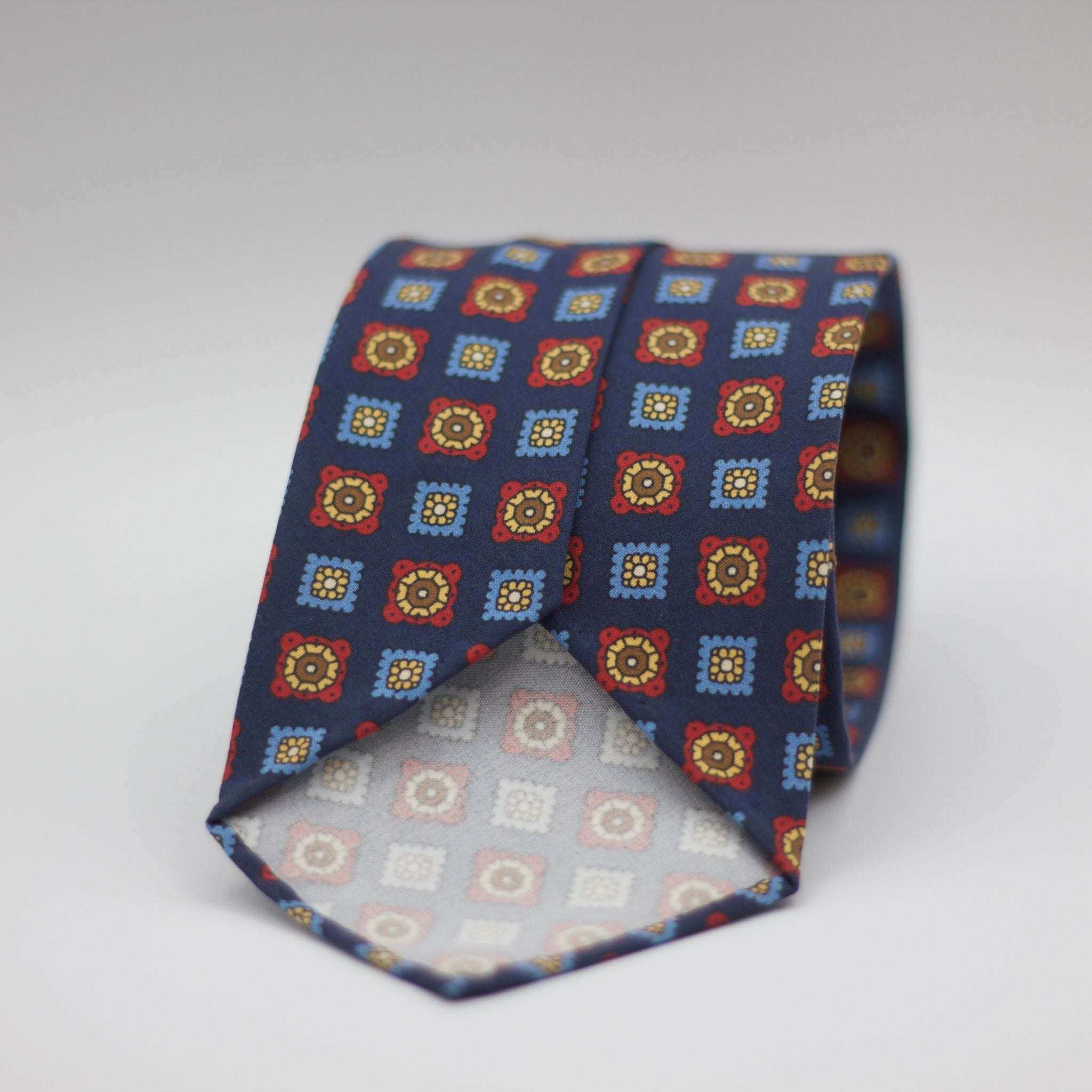 Cruciani & Bella  100% Printed Madder Silk  Italian fabric  Unlined tie Blue, light Blue, Red, Yellow and Brown motif Handmade in Italy 8 cm x 150 cm