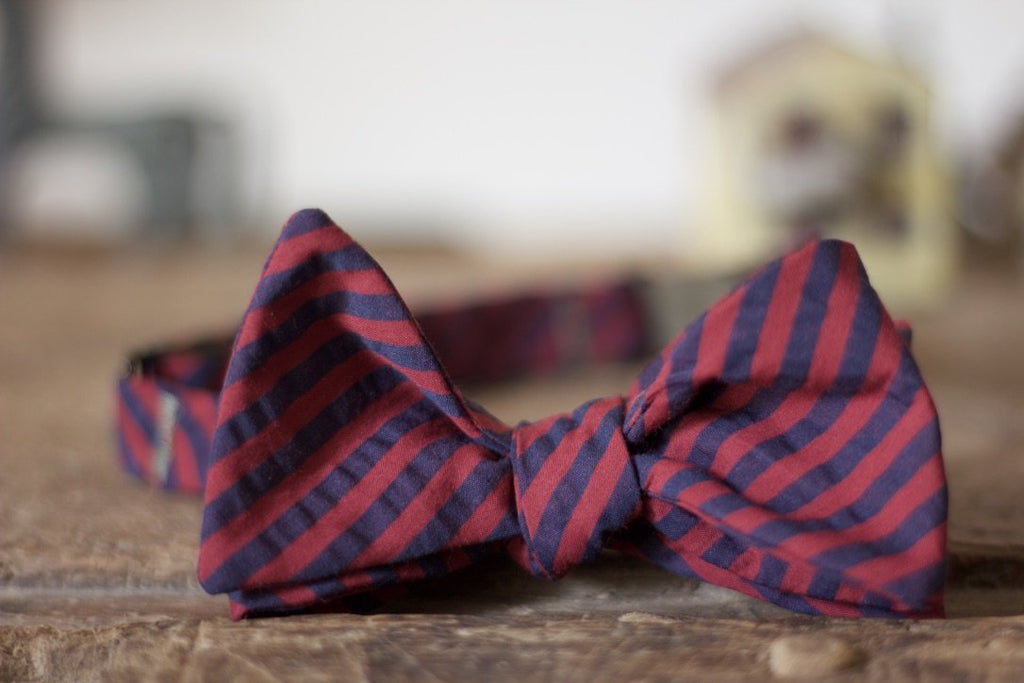 Noodles Bow Ties 100% Cotton  Red and blue seersucker Handcrafted in Italy Coated metal hardware  Olive green gabardine inside Hand-stitched labels Handmade boxes Self-tie bow ties