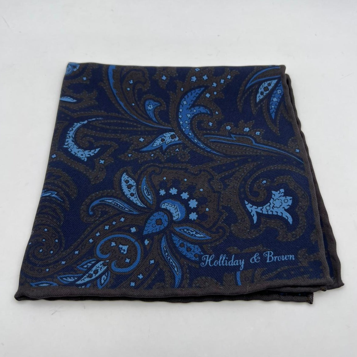 Holliday & Brown Hand-rolled   Holliday & Brown for Cruciani & Bella 100% Silk Blue, Brown  Double Faces Patterned  Motif  Pocket Square Handmade in Italy 32 cm X 32 cm #7029