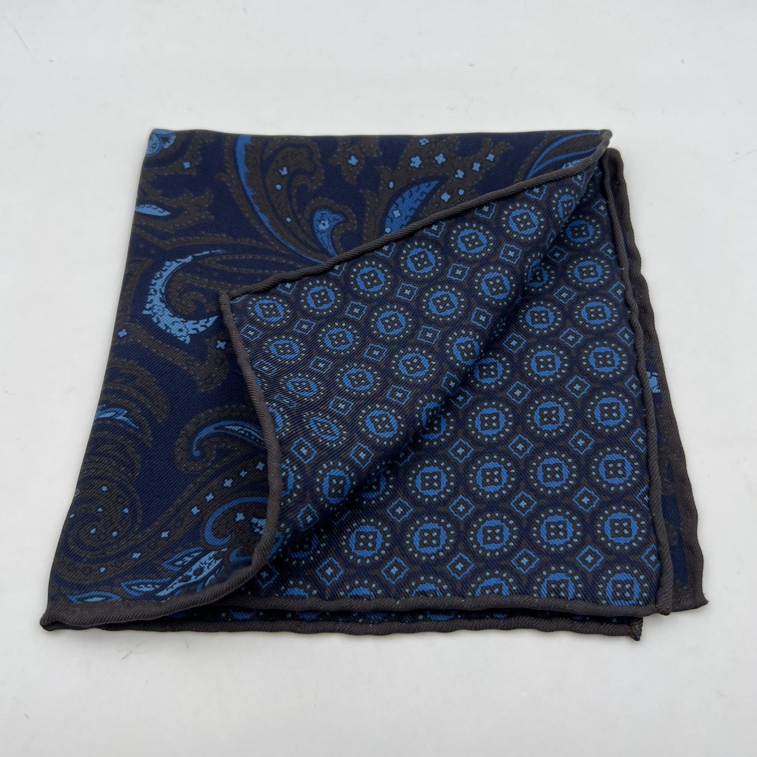 Holliday & Brown Hand-rolled   Holliday & Brown for Cruciani & Bella 100% Silk Blue, Brown  Double Faces Patterned  Motif  Pocket Square Handmade in Italy 32 cm X 32 cm #7029