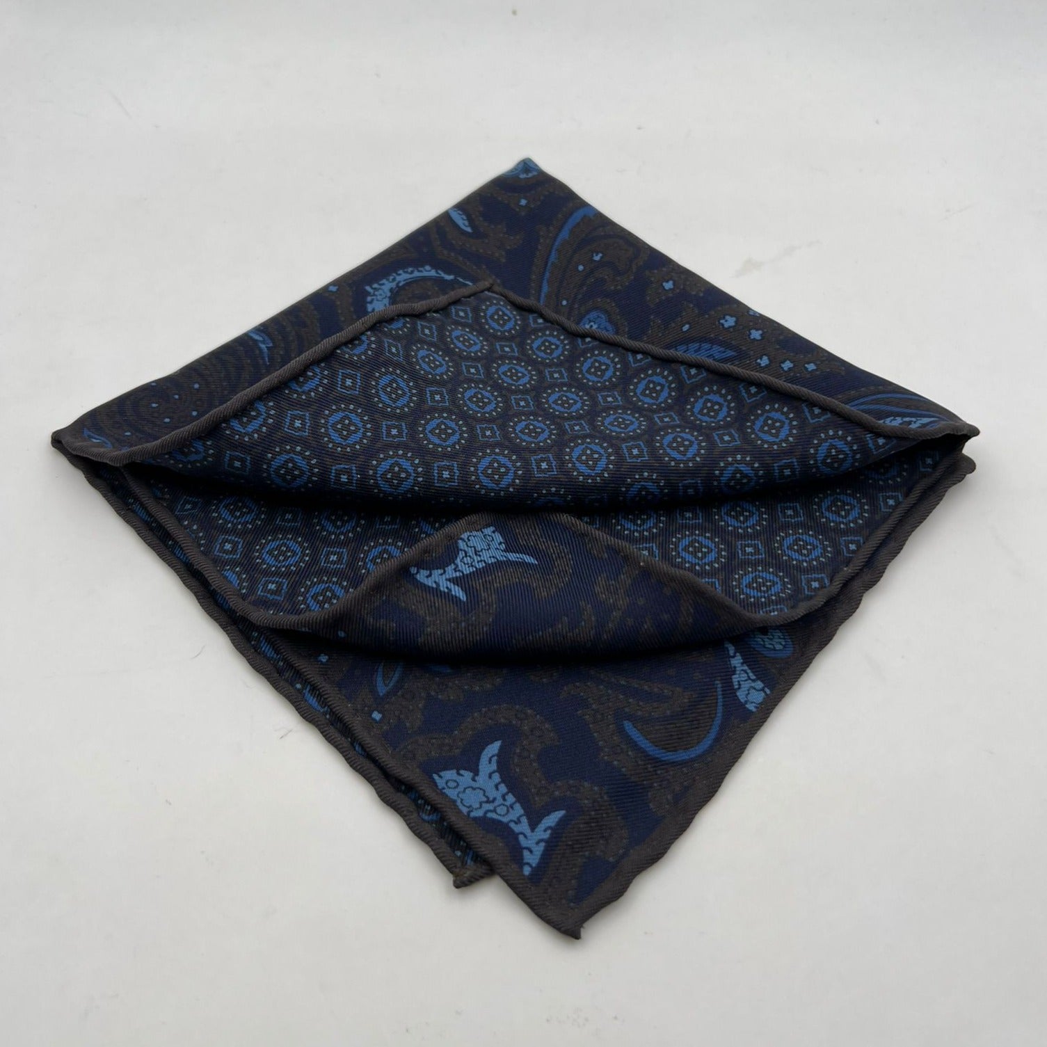 Holliday & Brown Hand-rolled   Holliday & Brown for Cruciani & Bella 100% Silk Blue, Brown  Double Faces Patterned  Motif  Pocket Square Handmade in Italy 32 cm X 32 cm #7029