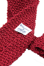 Red knitted tie